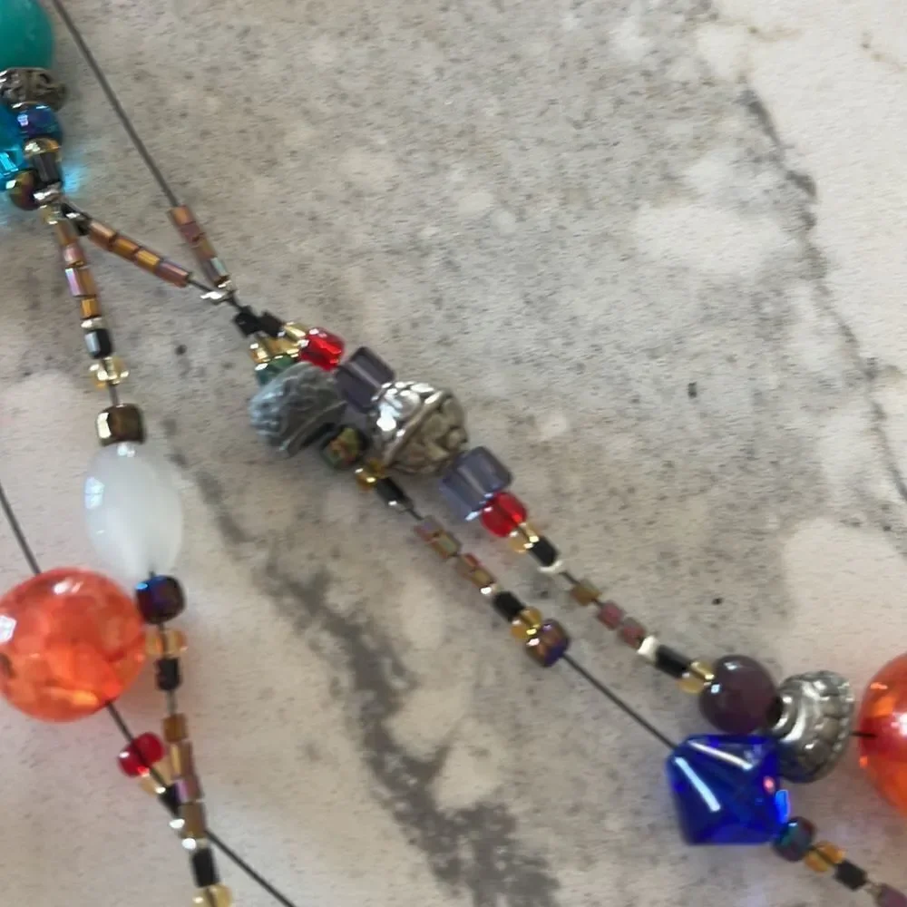 Fun multi color glass head necklace. All of the beads are glass. Art event